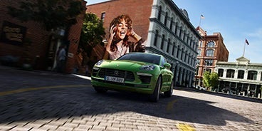 Blue Porsche Macan Turning a Corner in Sugar Land TX