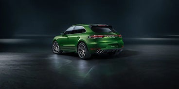 Man Stepping Out of the Porsche Macan Sugar Land TX