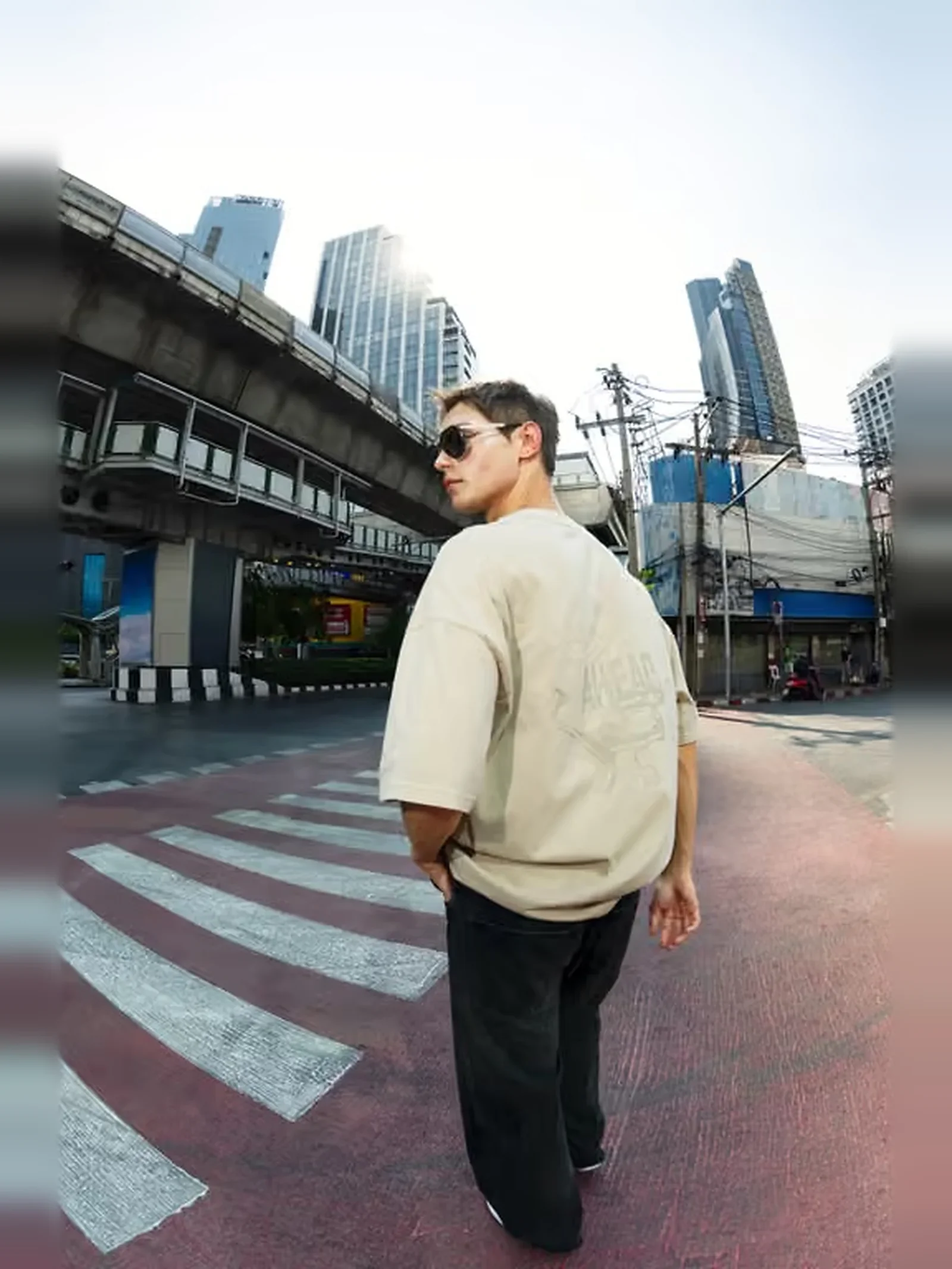 Man wearing Porsche Lifestyle apparel in an urban setting